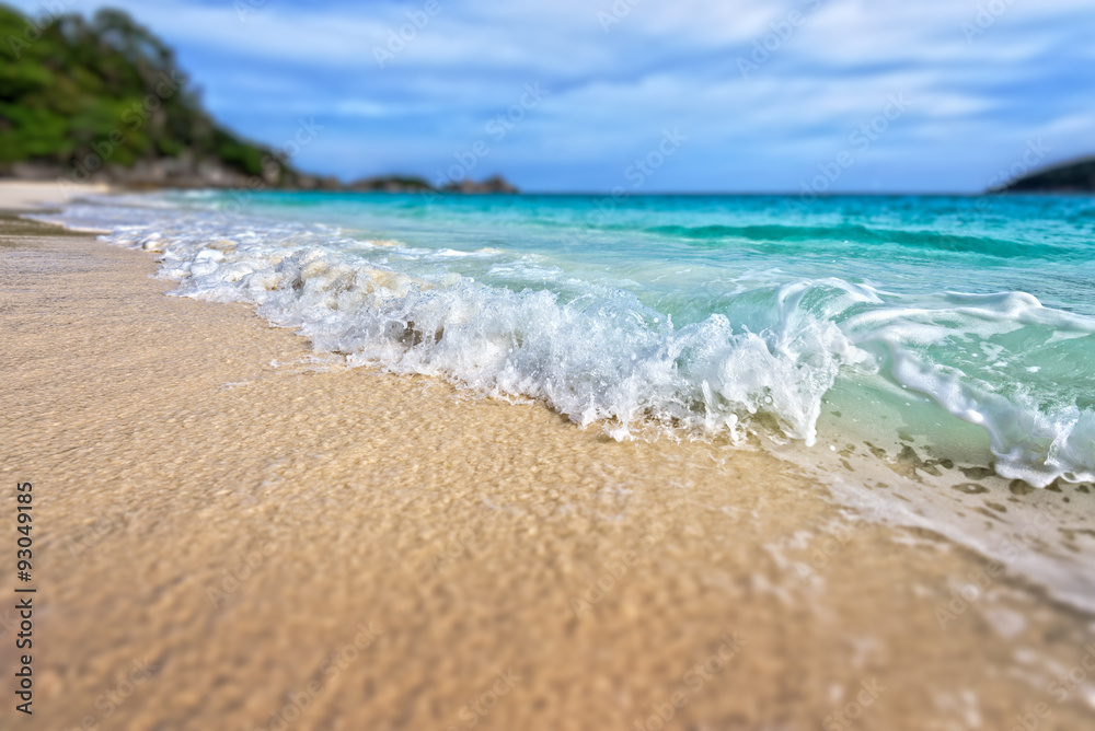 Tilt-Shift soft blur effect beautiful landscape blue sea white sand and waves on the beach during summer at Koh Miang island in Mu Ko Similan National Park, Phang Nga province, Thailand