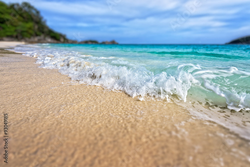 Tilt-Shift soft blur effect beautiful landscape blue sea white sand and waves on the beach during summer at Koh Miang island in Mu Ko Similan National Park, Phang Nga province, Thailand