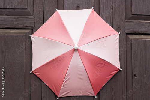 umbrella on wood wall