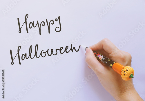 Happy halloween word written by Jack o lantern pumpkin pen on pa photo