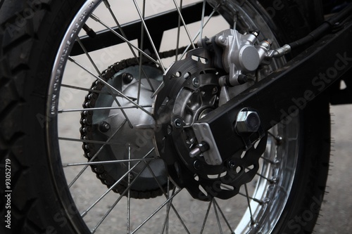 Motorcycle wheel in black and white. Street