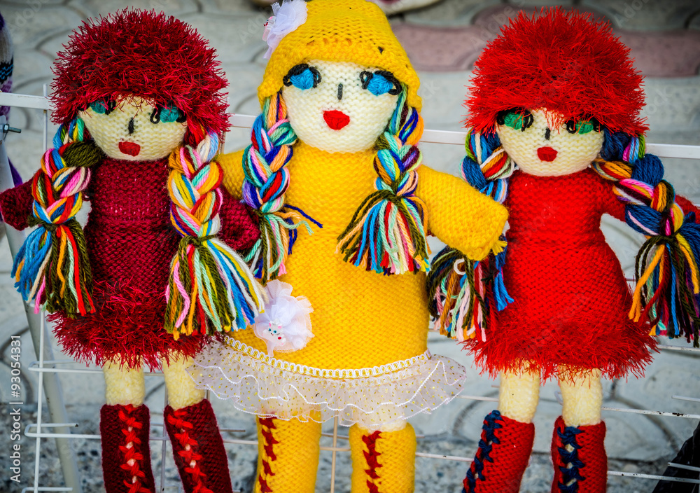 Caucasian knitted dolls on the market of souvenirs