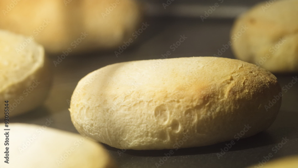 Time lapse zoom-in of biscuits baking on a cookie sheet in an oven; shallow focus on one biscuit. Time lapse zoom-in of biscuits baking on a cookie sheet in an oven; shallow focus on one biscuit.
