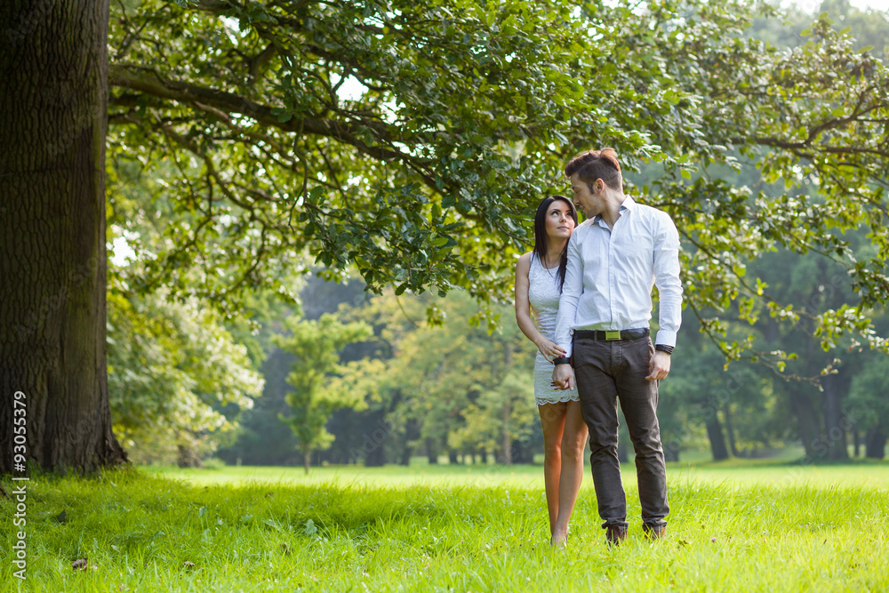 couple walking through park