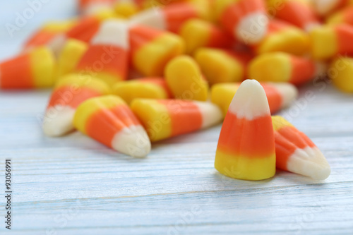 Halloween candy corns on blue wooden background