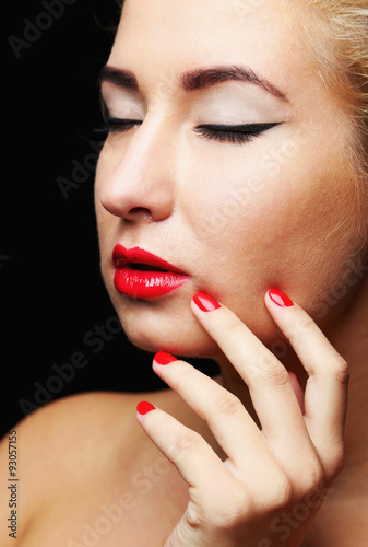 Beautiful model with make-up  red lips and manicure