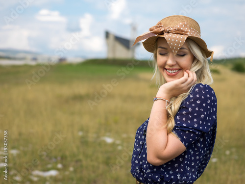 Romantic girl in a rural barley field. Summer, autumn life