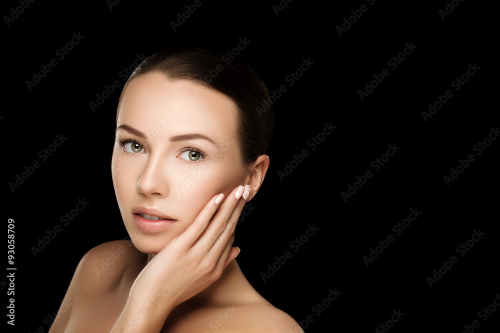 Naklejka premium Beautiful young brunette woman with clean fresh skin with nude makeup with hands at face. Closeup real photo 