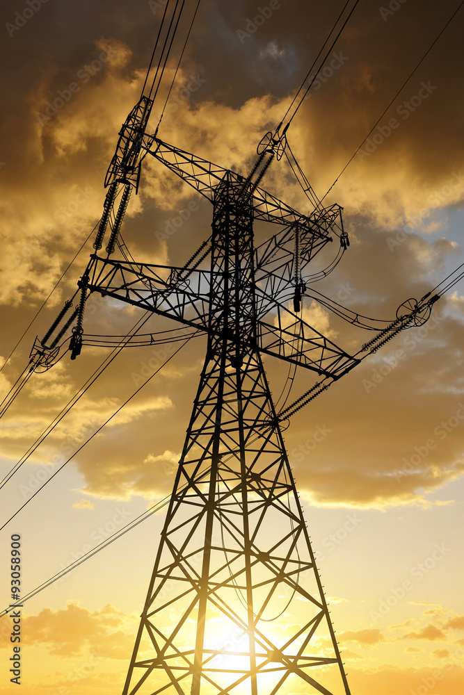 Obraz premium High voltage towers against the sunset