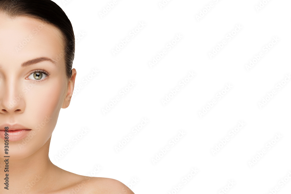 half face of beautiful young brunette woman with clean fresh skin with nude makeup looking straight. Closeup real photo half face of beautiful young brunette woman with clean fresh skin with nude makeup looking straight. Closeup real photo