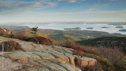 Pan of a portion of Bar Harbor and Frenchman Bay and the Porcupine Islands shortly after a muted sunrise, as seen from the top of Cadillac Mountain in Acadia National Park, Maine.