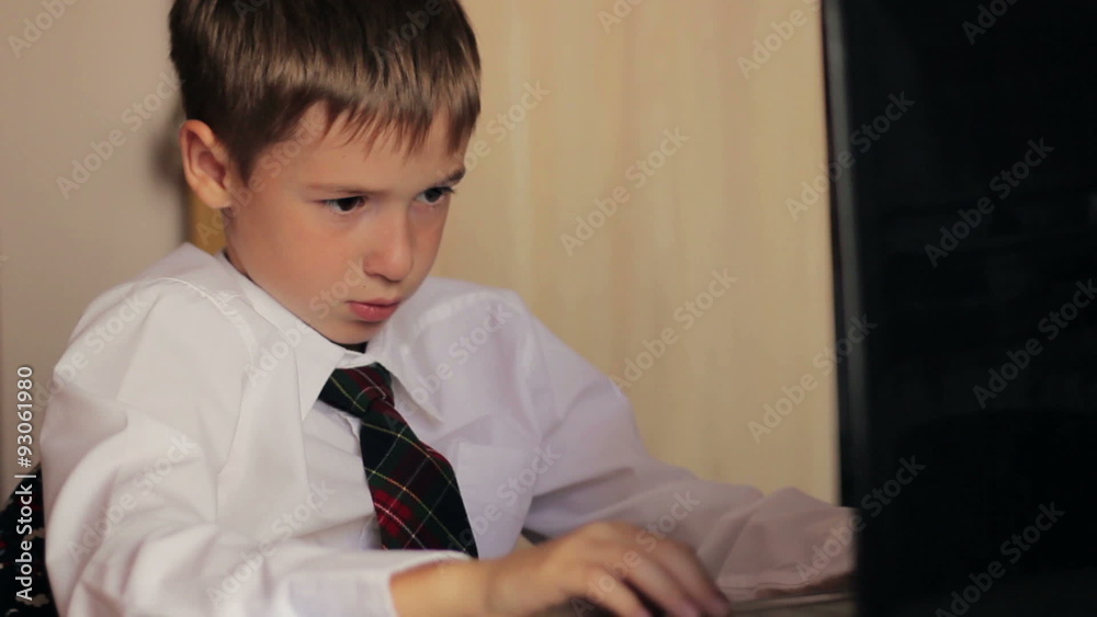 Boy working on laptop computer concept of education, training Boy working on laptop computer concept of education, training