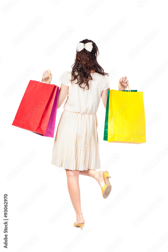 Woman with shopping bags on white background.