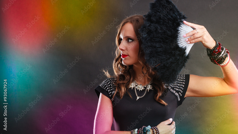 beautiful brunette woman with black fan in hand beautiful brunette woman with black fan in hand