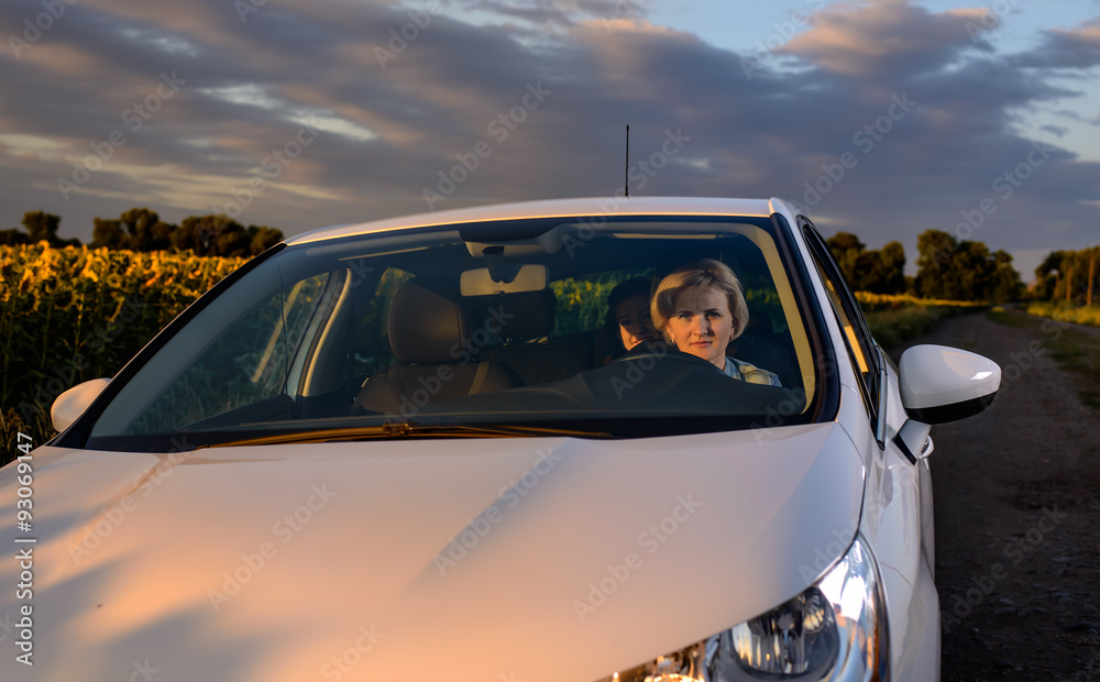 Woman driving at night on a country road