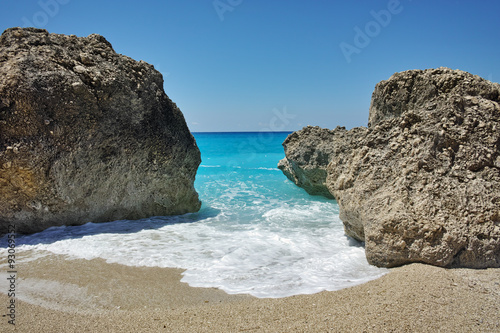 Rocks in the blue waters of Megali Petra Beach, Lefkada, Ionian Islands, Greece