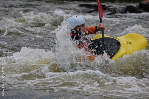 Kayaker doing the eskimo roll. Southern Bug river, Ukraine.