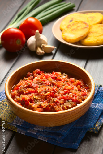 Colombian hogao or criollo sauce (salsa criolla) made of cooked onion and tomato, served as accompaniment, photographed with natural light (Selective Focus, Focus in the middle of the sauce)