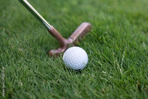 close of putter and ball