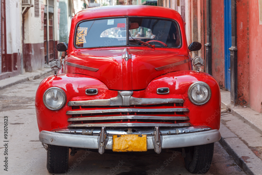 Vintage red car on the street of old city, Havana, Cuba