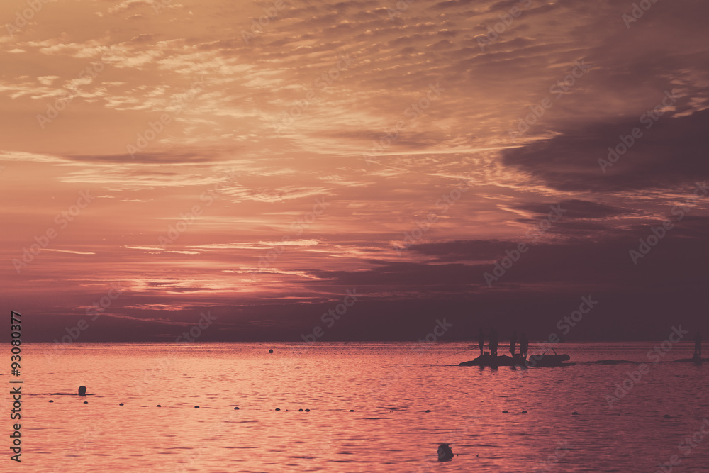 Sea fishing at sunset.