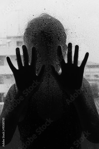 Horror woman behind the matte glass ,style  black and white, Blurry hand and body , soft focus