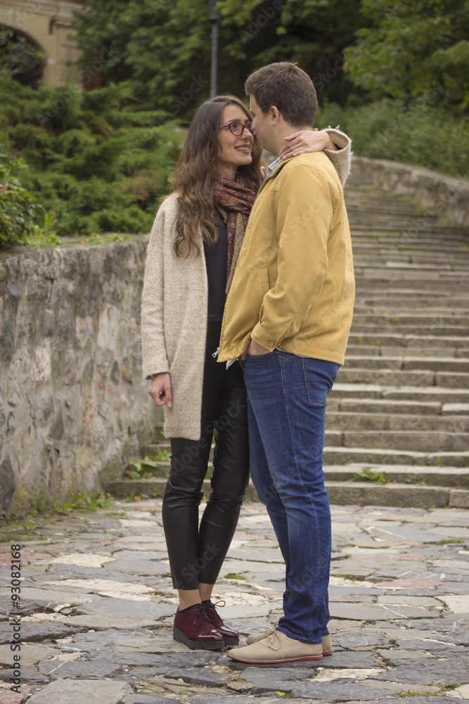 young beautiful couple in 20s posing, looking at each other. young beautiful couple in 20s posing, looking at each other.