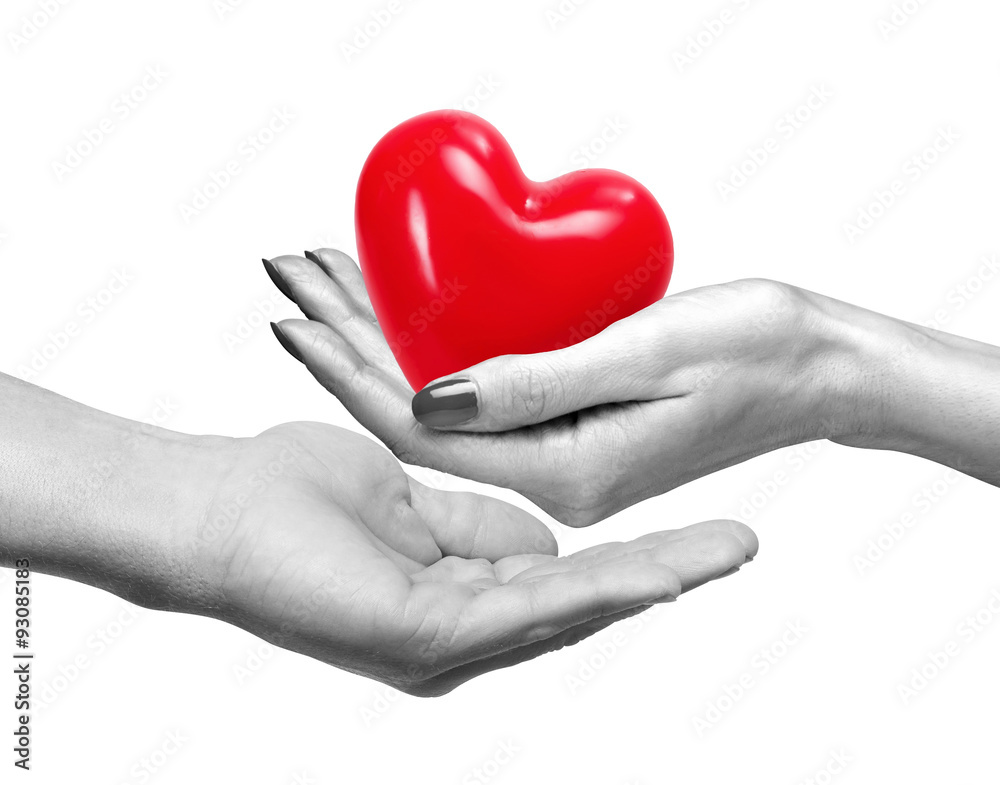 Red heart in woman hand and man hand, isolated on white Red heart in woman hand and man hand, isolated on white