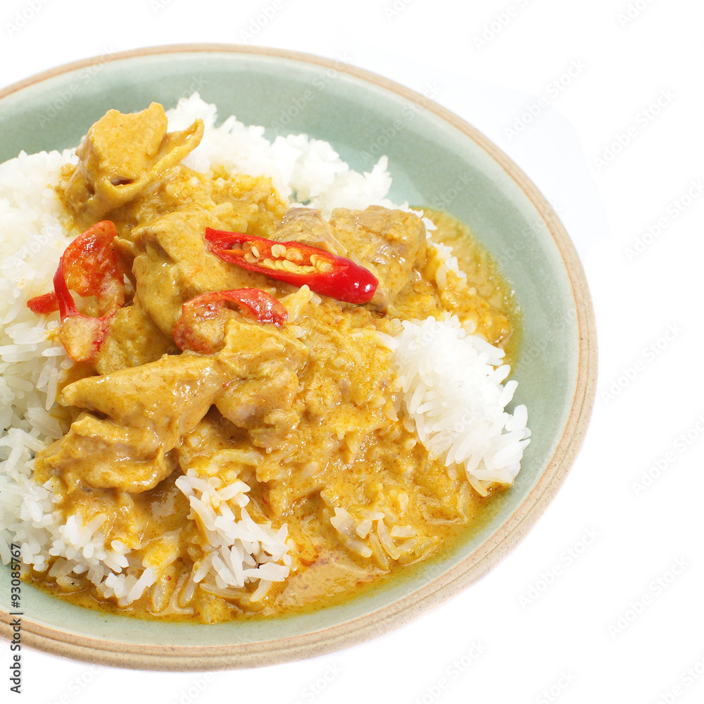 Red curry chicken and white rice on white background