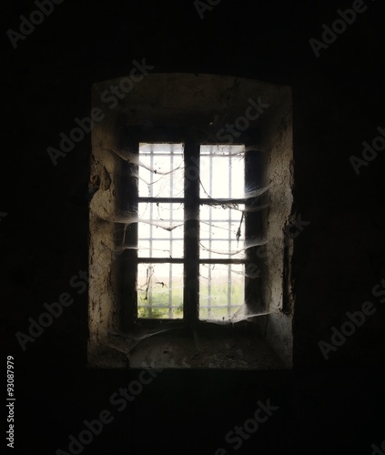 old window with cobwebs