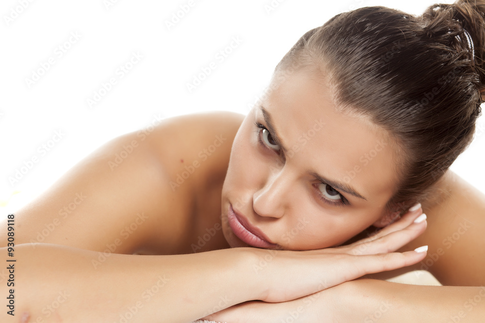 portrait of pretty unhappy woman lying on a white background portrait of pretty unhappy woman lying on a white background