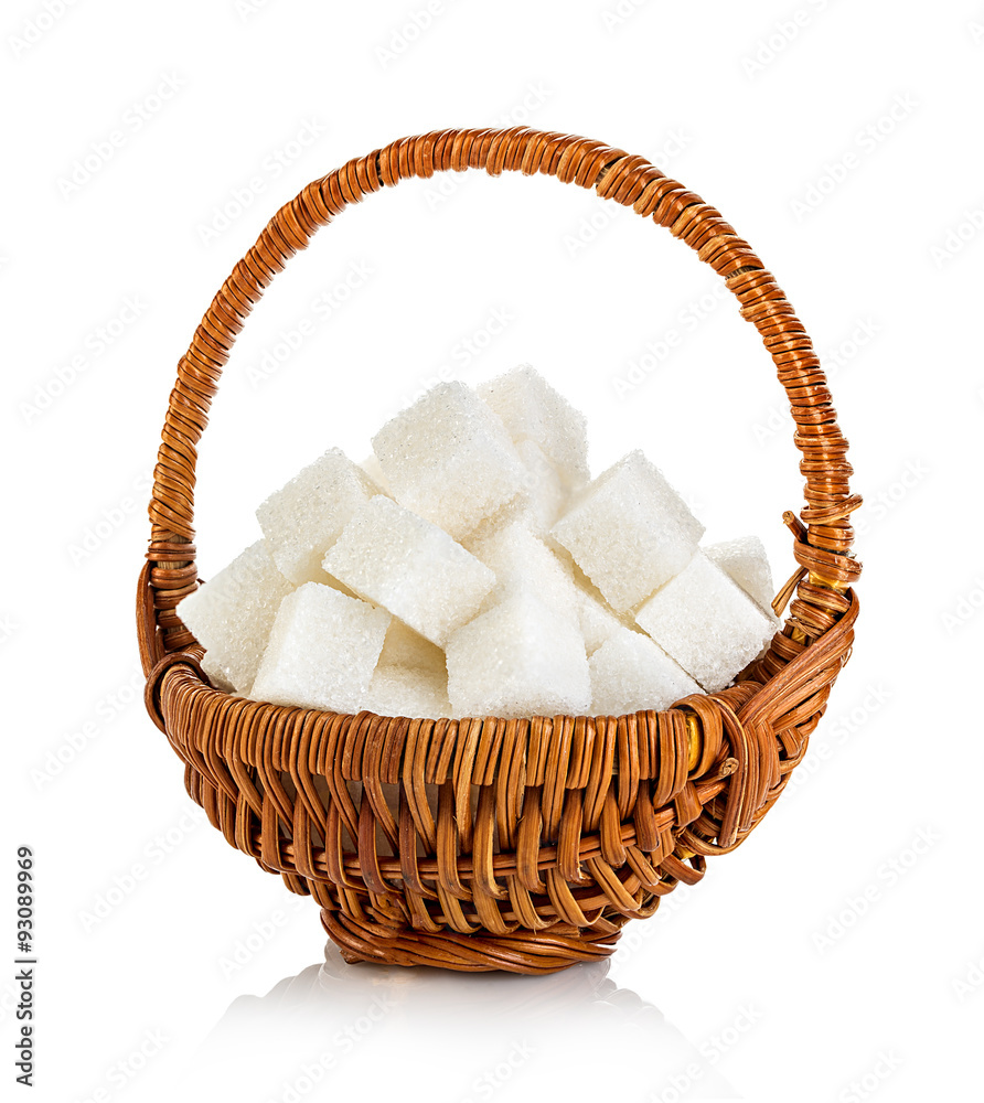 sugar cubes in a brown wicker basket close-up isolated on a white background sugar cubes in a brown wicker basket close-up isolated on a white background