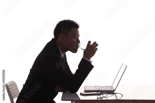 silhouette business man expressing drinking photo