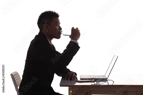 silhouette business man expressing drinking photo