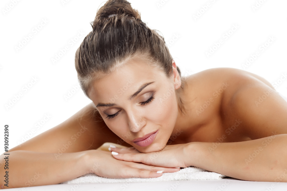 portrait of a beautiful young woman lying on a white background portrait of a beautiful young woman lying on a white background