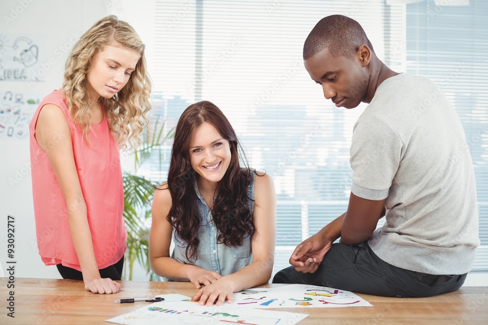 Portrait of smiling woman with business people working at desk Portrait of smiling woman with business people working at desk