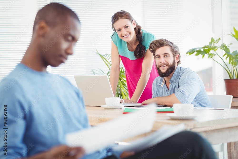 Portrait of business people at desk with person Portrait of business people at desk with person
