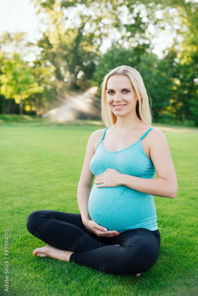 Pregnant women doing fitness exercises in the park. Pregnant women doing fitness exercises in the park.