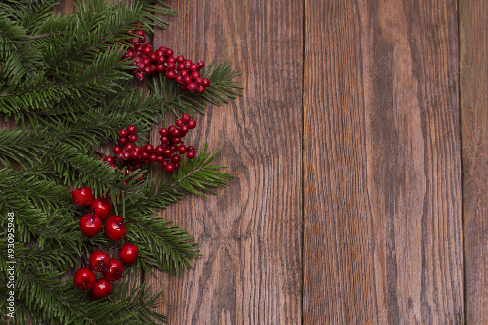 Christmas fir tree on wooden background
