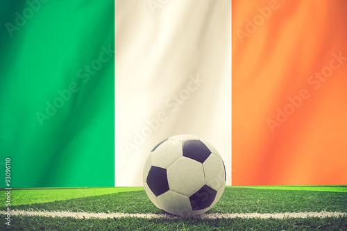 Soccer ball and national flag of Ireland vintage color
