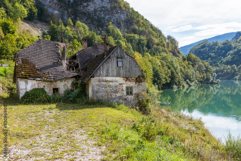 Deserted farm at the Enns river in Upper Austria. The roof is collapsed. The management of the farm is not worthwhile any more. Agriculture is furthermore a major economic factor in Austria