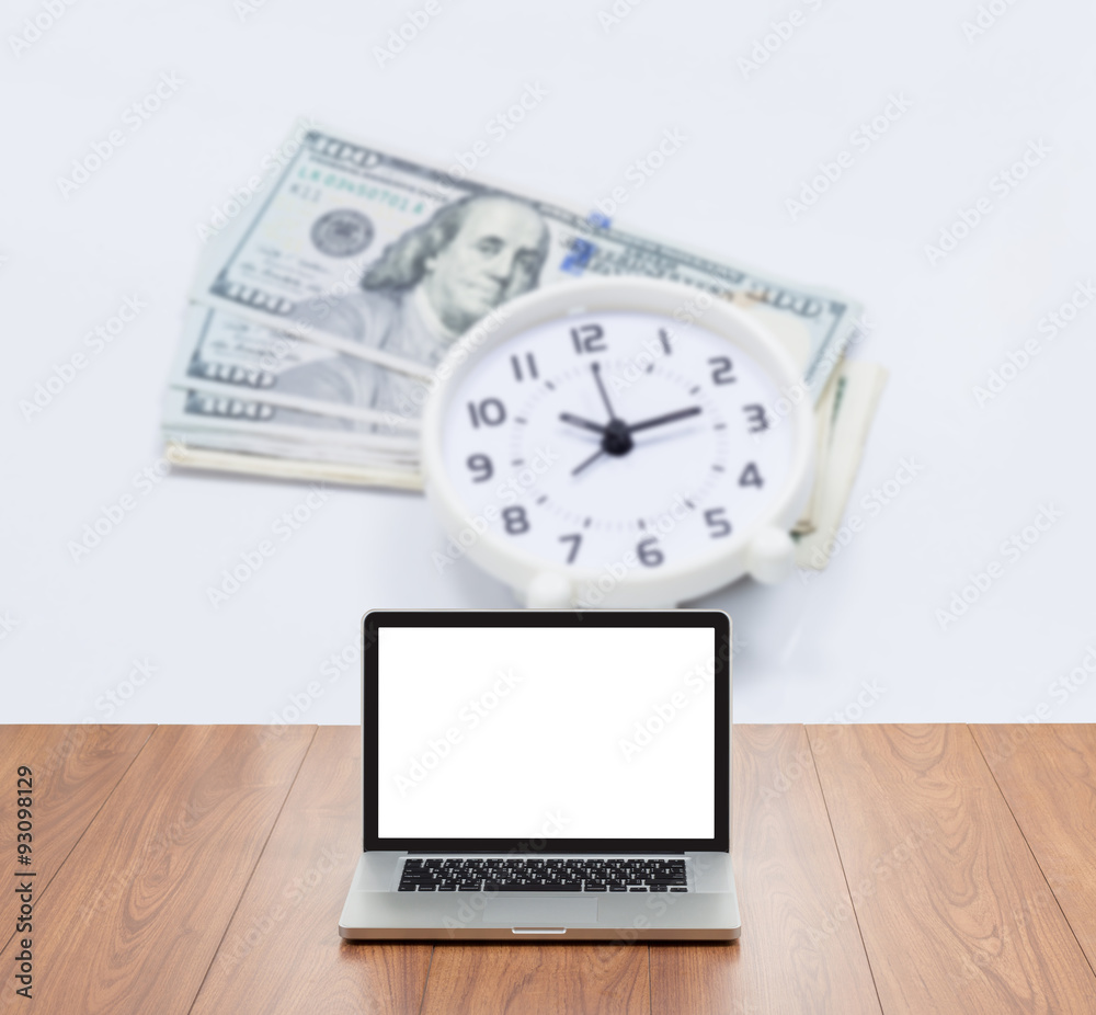 Blank screen laptop computer with blur money and clock backgroun Blank screen laptop computer with blur money and clock backgroun