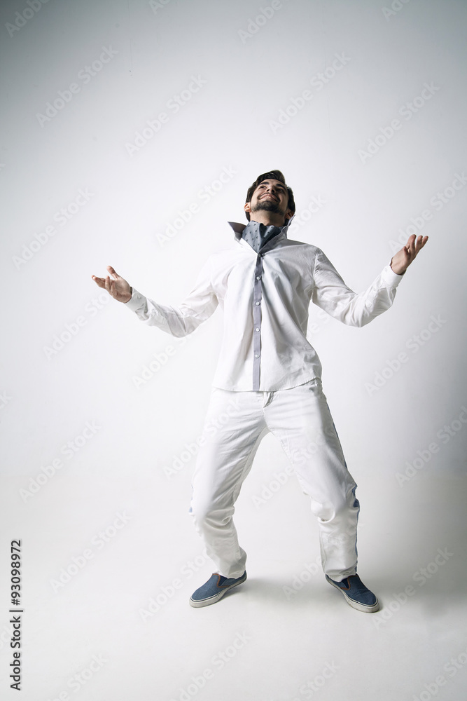 Portrait of an emotional young man wearing white. Portrait of an emotional young man wearing white.