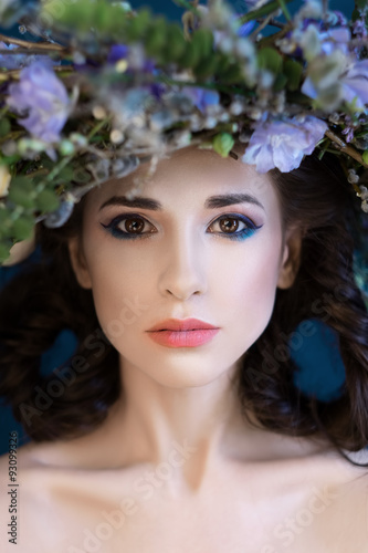 Close-up Portrait of a beautiful spring girl with wreath on head