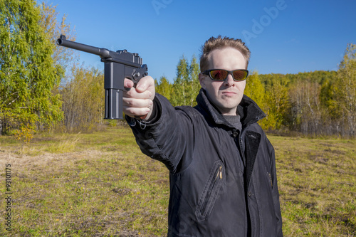 A man shoots a gun Mauser