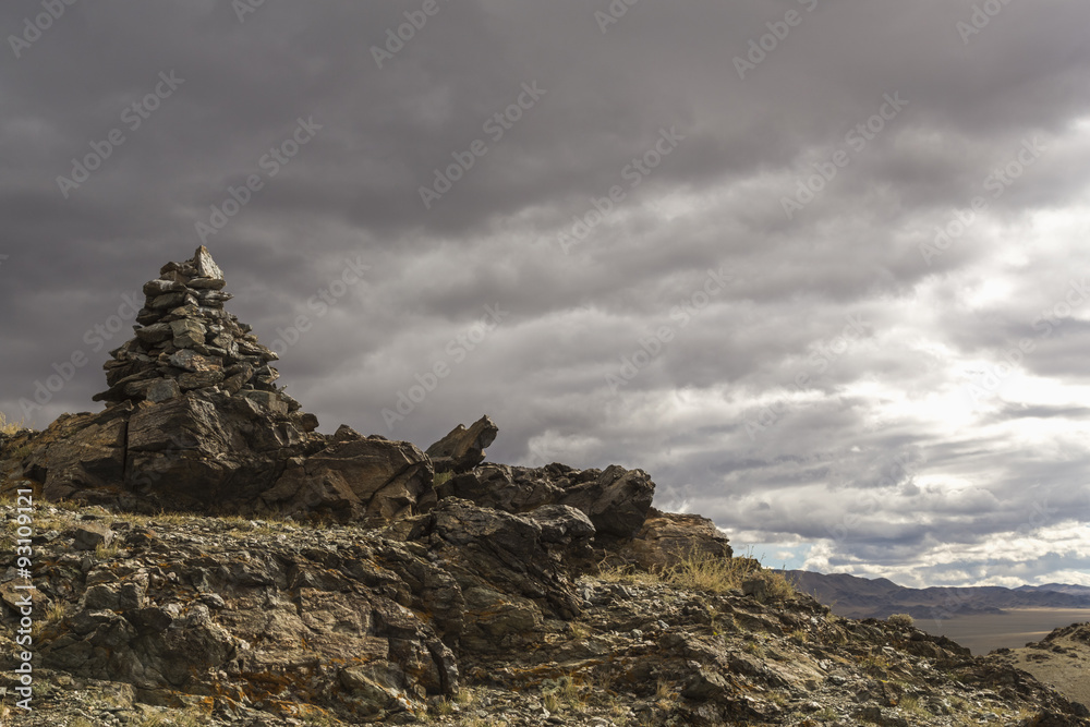 A pile of stones ritual in Mongolia A pile of stones ritual in Mongolia