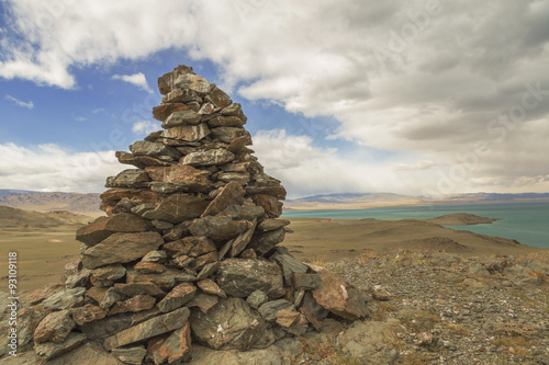 A pile of stones ritual on the lake Uureg Nuur in Mongolia © tiplyashina