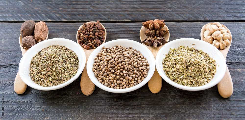 Spices and herbs in  bowls.