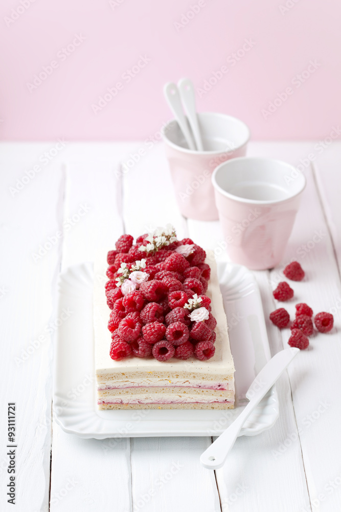 Green buckwheat cake with cream and fresh raspberries, selective focus Green buckwheat cake with cream and fresh raspberries, selective focus