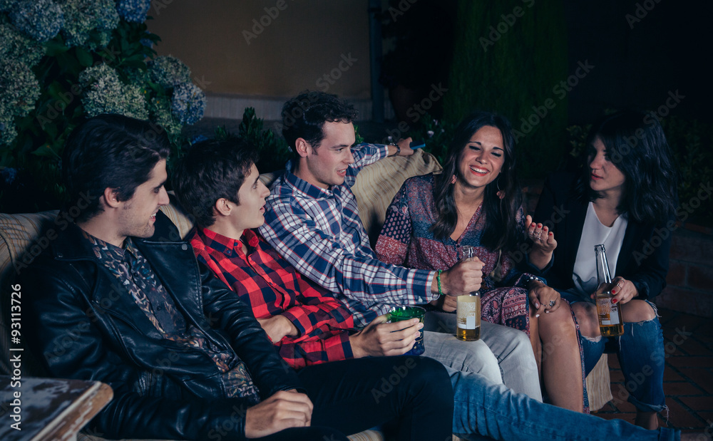 Happy friends drinking and having fun in a party Happy friends drinking and having fun in a party
